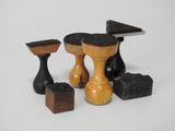 four pieces of wood that are sitting on a table