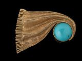 une image représentant une bague sertie d'une pierre turquoise