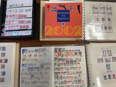 many different types of stamps on the pages of a book