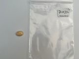 a bag of pills and a pill on a table