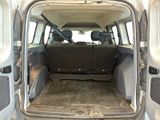the back of a van with the door open and the passenger seat down