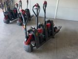 many different types of hand trucks lined up in a row