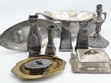 a lot of silver items that are on the table