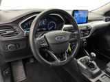 the interior of a car with a steering wheel, dashboard, and dashboard controls