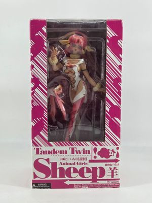 a close up of a box with a doll in it