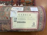 a label on the back of a chair that says gabbeh