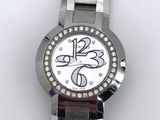 a close up of a wrist watch on a white surface