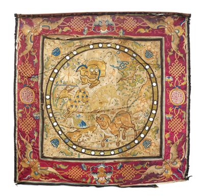 une tapisserie brodée représentant un homme et un chien