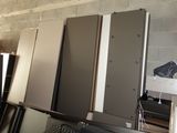 many different types of cabinets in this room