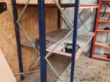 a room that has a shelf and a ladder in it