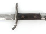 a close up of a knife on a white surface with a white background