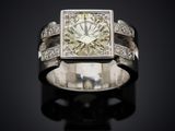 an image of a diamond ring on a black surface