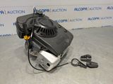 a black and white photo of a blower with a cord attached