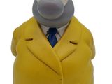 a figurine of a man in a suit and tie