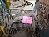 a pile of wires and a machine with a price tag on it