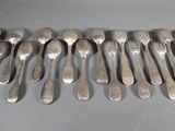 a lot of spoons that are sitting on a table