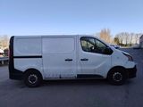 a white van parked in a parking lot next to a parking lot