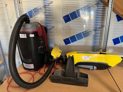 a vacuum that is sitting on a table next to a box