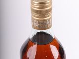 an image of a bottle of liquor on a white surface