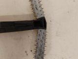 a toothbrush that is laying on the floor next to a toothbrush