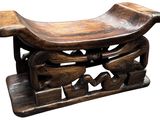 a wooden bench with carvings on it on a white background