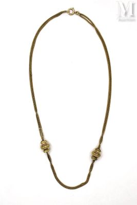 a close up of a necklace on a white background
