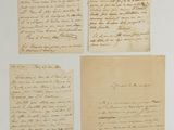a group of four handwritten letters on paper with ink on them