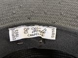 a close up of a hat with a tag on it