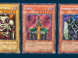 three cards with different designs on them on a blue background