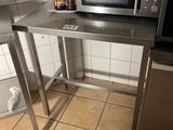 a microwave sitting on top of a table in a kitchen