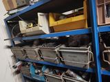 a blue shelving with lots of tools on top of it