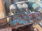 an old engine that is sitting in the dirt