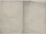 an old book with a piece of paper on top of it