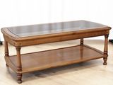 a wooden table with a glass top on a hard wood floor