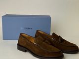 men ' s brown sued slippers with tassels and a blue box