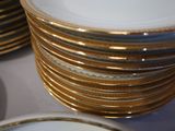 many plates stacked on top of each other on a table
