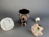 two vases that are next to each other on a table