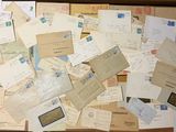 a box full of old letters and envelopes sitting on a table