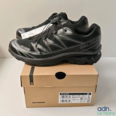 the shoe is sitting on top of a box on a table