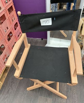 a black director ' s chair in a store