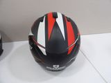 a helmet sitting on a table next to a pair of shoes