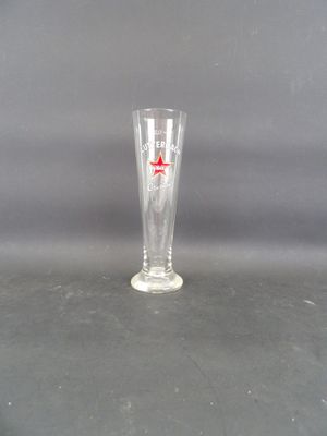 a glass with a red star on it on a table