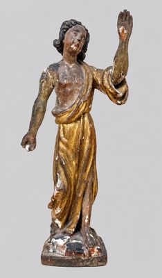 statue of a woman holding her hand up in the air
