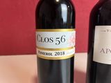 two bottles of wine that are sitting on a table