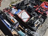 a pile of tools sitting on top of a pallet on the ground