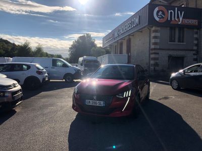 a red car that is parked in front of a building