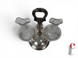 a glass candle holder with three candles inside of it