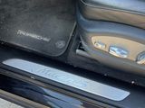 a close up of a car door handle with a bag in it