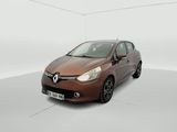 the brown car is parked in a white room with white walls