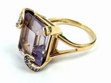 an image of a ring with an amethorate and diamonds on it
